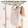A close-up of a clothing rack with clothes hanging on it, featuring text overlays describing product features. Produktbild-Vorschau