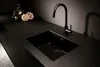 A modern black kitchen sink and faucet. Produktbild-Vorschau