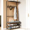 A coat rack with a bench and shoe storage in a hallway. Produktbild-Vorschau