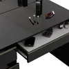 A close-up view of a black vanity table with makeup and a drawer open. Náhled obrázku produktu
