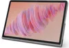 A tablet device with a colorful abstract wallpaper displayed on its screen, set against a light gray and white background. Produktbild-Vorschau