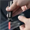 A person is holding a black safety hammer and using it to cut a seatbelt. Náhľad obrázku produktu