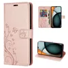 Collage of a rose gold flip phone case with floral and butterfly design, showing the case closed, open with cards and cash, and the phone inside. Produktbild-Vorschau
