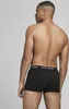 A man wearing black boxer briefs, viewed from the back. Produktbild-Vorschau