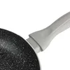 A close-up view of the handle and rim of a frying pan. Náhľad obrázku produktu