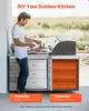 A man preparing to grill outdoors next to a modular outdoor kitchen unit. Produktbild-Vorschau