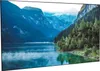 A scenic landscape with mountains, a lake, and trees. Produktbild-Vorschau