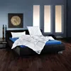 A bedroom scene with a bed, pillows, and a duvet. Produktbild-Vorschau