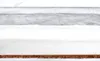 A close-up view of the layered materials of a baby mattress. Anteprima dell’immagine prodotto