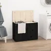 A laundry room with a washing machine and a wooden laundry chest. Anteprima dell’immagine prodotto