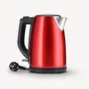 A red electric kettle with a black handle and base, connected to a black power cord and plug. Anteprima dell’immagine prodotto
