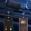 A Ugreen Bluetooth receiver/transmitter is shown connected to a car's audio system, with two smartphones below demonstrating its use for calls and music. Anteprima dell’immagine prodotto