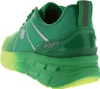 A side view of a green and yellow sneaker. Produktbild-Vorschau
