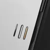 A close-up view of a black phone case with three oval-shaped elements on a light gray background. Podgląd zdjęcia produktu