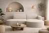 A modern living room with a sectional sofa, coffee table, and floor lamp. Produktbild-Vorschau
