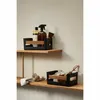 Two storage baskets are shown on wooden shelves, one containing cleaning supplies and the other containing cleaning tools. Produktbild-Vorschau