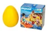 A yellow egg-shaped toy and a Playmobil "Summer Fun" playset box are shown side-by-side against a white background. Anteprima dell’immagine prodotto