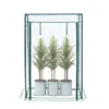 A greenhouse with three potted plants inside, shown against a white background. Náhled obrázku produktu