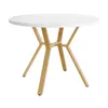 A round dining table with a white marble-look top and golden metal legs, presented against a white background. Podgląd zdjęcia produktu