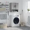 A laundry room scene with a washing machine, drying rack, and a wall cabinet. Produktbild-Vorschau