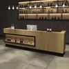 A bar counter with shelves of bottles in the background. Produktbild-Vorschau