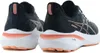 A pair of black and coral Asics running shoes shown from a rear-side angle against a white background. Produktbild-Vorschau