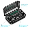 A pair of black wireless earbuds in an open charging case, with digital displays showing battery levels. Produktbild-Vorschau