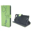 A green flip phone case with a "be happy" inscription and a heart design is shown from two angles against a white background. Produktbild-Vorschau