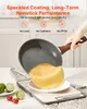 A hand holding a speckled frying pan over a cutting board with limes and tomatoes. Anteprima dell’immagine prodotto