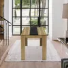 A dining table with chairs in a modern home setting with large windows. Náhled obrázku produktu