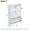 A white shoe cabinet with gold legs and handles, shown with dimensions indicated by lines and numbers. Produktbild-Vorschau