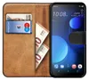 A book-style phone case with a smartphone inside, showing cards and banknotes. Produktbild-Vorschau
