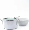 A white pot with a glass lid and a white bowl are placed on a white background. Anteprima dell’immagine prodotto