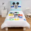 A Disney Mickey Mouse themed bedding set on a child's bed, with a bedside table and rocking chair in the background. Produktbild-Vorschau