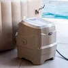 A hot tub pump unit is shown next to an inflatable hot tub, with a swimming pool in the background. Náhľad obrázku produktu