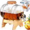 A beverage dispenser with a tap, a box, and pineapple slices. Produktbild-Vorschau