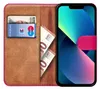 A book-style phone case with a phone, cards, and banknotes inside. Náhled obrázku produktu