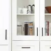 Kitchen cabinet with various items for making coffee and storing food. Náhled obrázku produktu