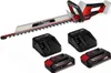 A cordless hedge trimmer with two batteries and two chargers, displayed on a white background. Produktbild-Vorschau