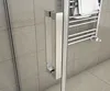 A close-up view of a shower door handle and a towel rack with a towel on it, set against a tiled wall. Produktbild-Vorschau