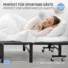 A woman is sleeping on a foldable guest bed. Náhľad obrázku produktu