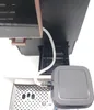 Close-up of a coffee machine's drip tray and water tube. Produktbild-Vorschau