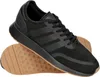 A pair of black Adidas sneakers with a gum sole, shown from a side angle. Produktbild-Vorschau
