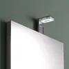A close-up shot of a modern bathroom mirror with an integrated LED light. Anteprima dell’immagine prodotto