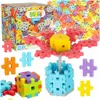 A collection of colorful building blocks, some assembled into structures, with the product packaging in the background. Produktbild-Vorschau