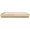 A side view of a wooden bed frame on a white background. Produktbild-Vorschau