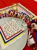 A table setting with festive decorations for a carnival or party. Produktbild-Vorschau