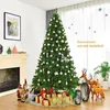 A decorated Christmas tree in a living room setting, with presents underneath and decorative elements around it. Náhled obrázku produktu