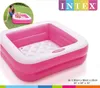 A mother and child playing in a pink inflatable pool. Produktbild-Vorschau