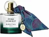 A bottle of Goutal perfume with a decorative scarf and charm. Voir les images du produit